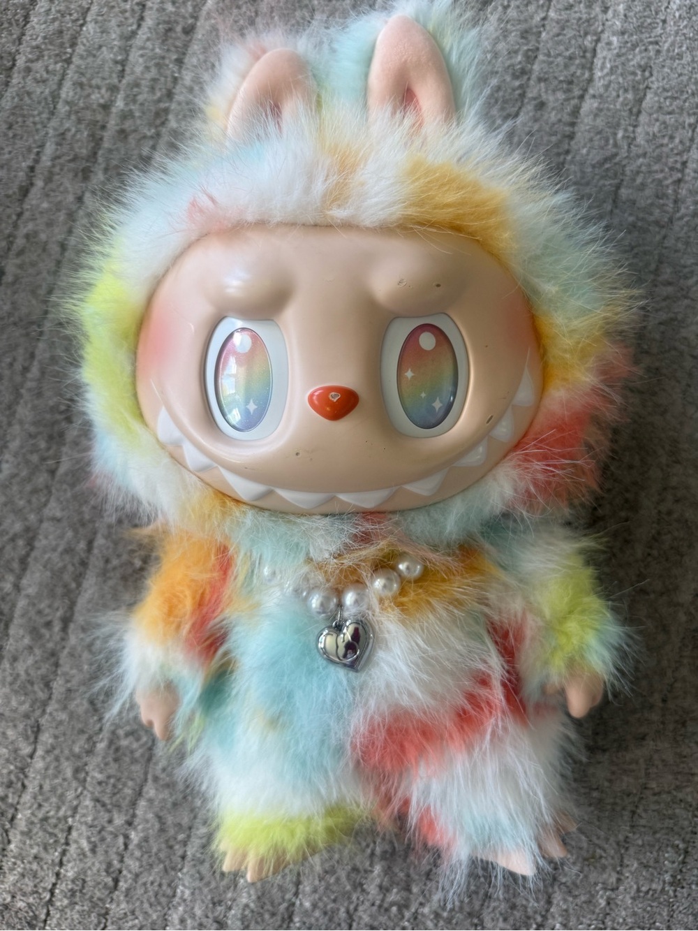 Plush Rainbow Fur Fantasy Figure with Starry Eyes - Multicolor